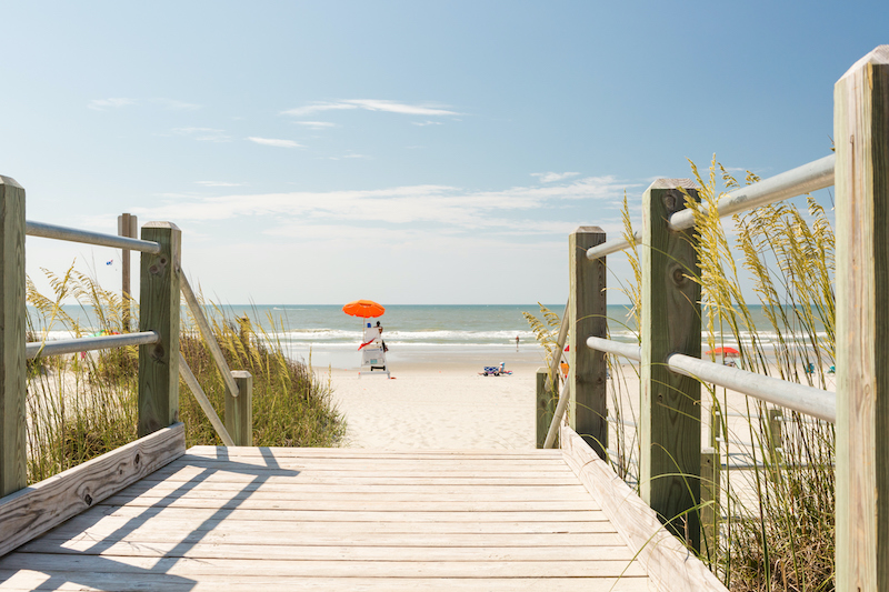 Families enjoy a beach along the Grand Strand.