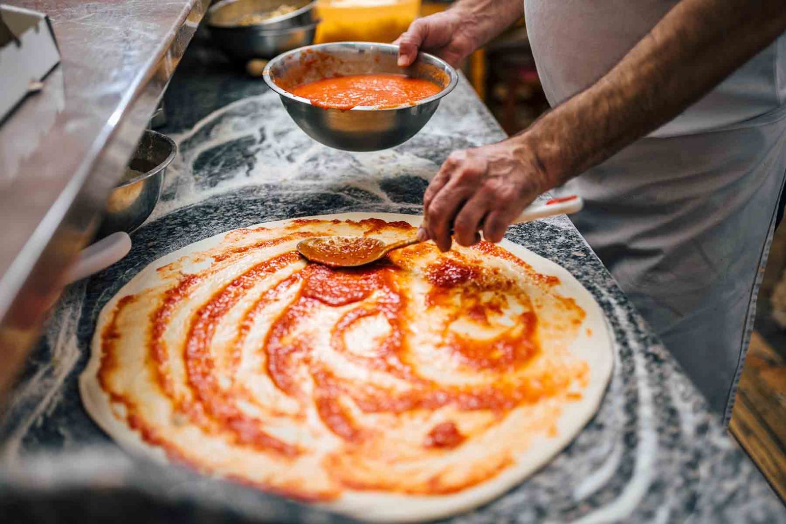 Chef making a pizza