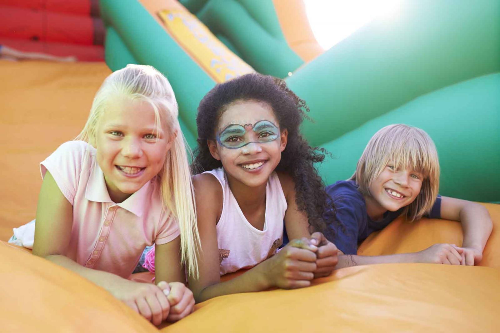 Kids play in a bounce house