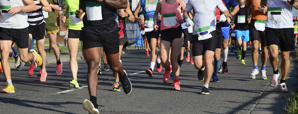 view of people's feet running a marathon