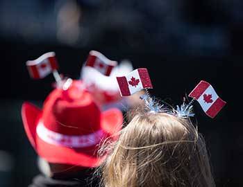 People wearing Canadian flag hats